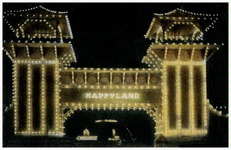(Image: Arch of the Happyland Entrance at Night)