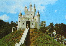 (Image Left: People Climb the Steps to the `Castle
 Slide')