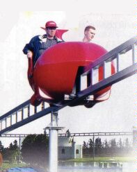 (Image Right: Riders Cruise above the Lake on the
 Monorail)