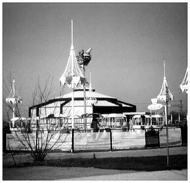 (Image: View of the Carousel Building and `Swing Boats' Ride.)