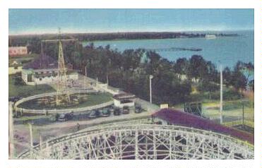 (Image: High-Angle View Looking Over the Rides Area and Water)